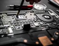 Professional laptop repair technician fixing laptop screen at customer's home with tools and genuine parts